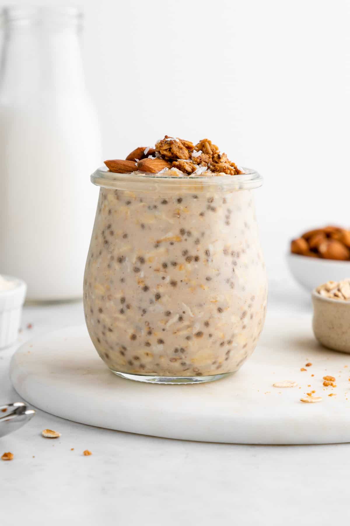 protein overnight oats in a jar with chia seeds, yogurt, and protein powder