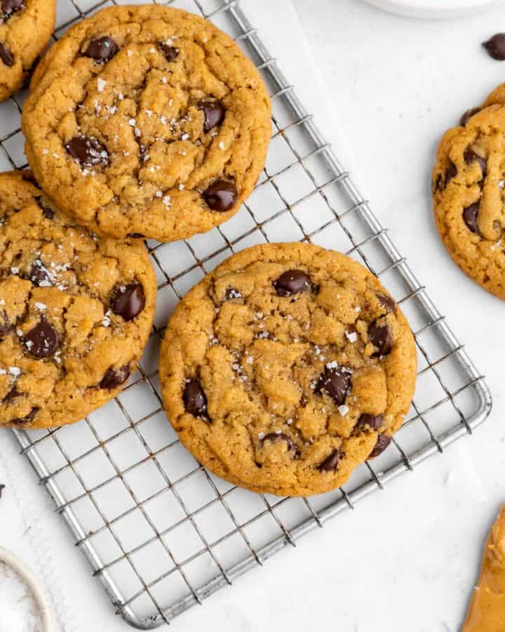 vegan peanut butter chocolate chip cookies on a wire cooling rack