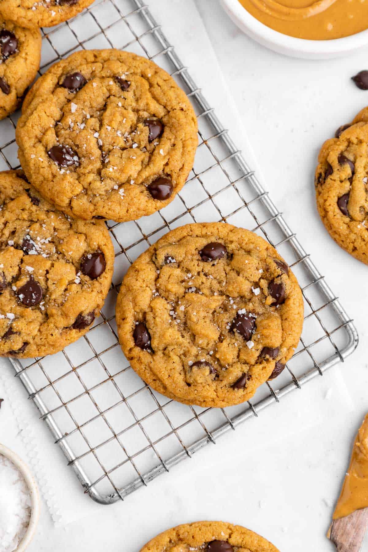 vegan peanut butter chocolate chip cookies on a wire cooling rack