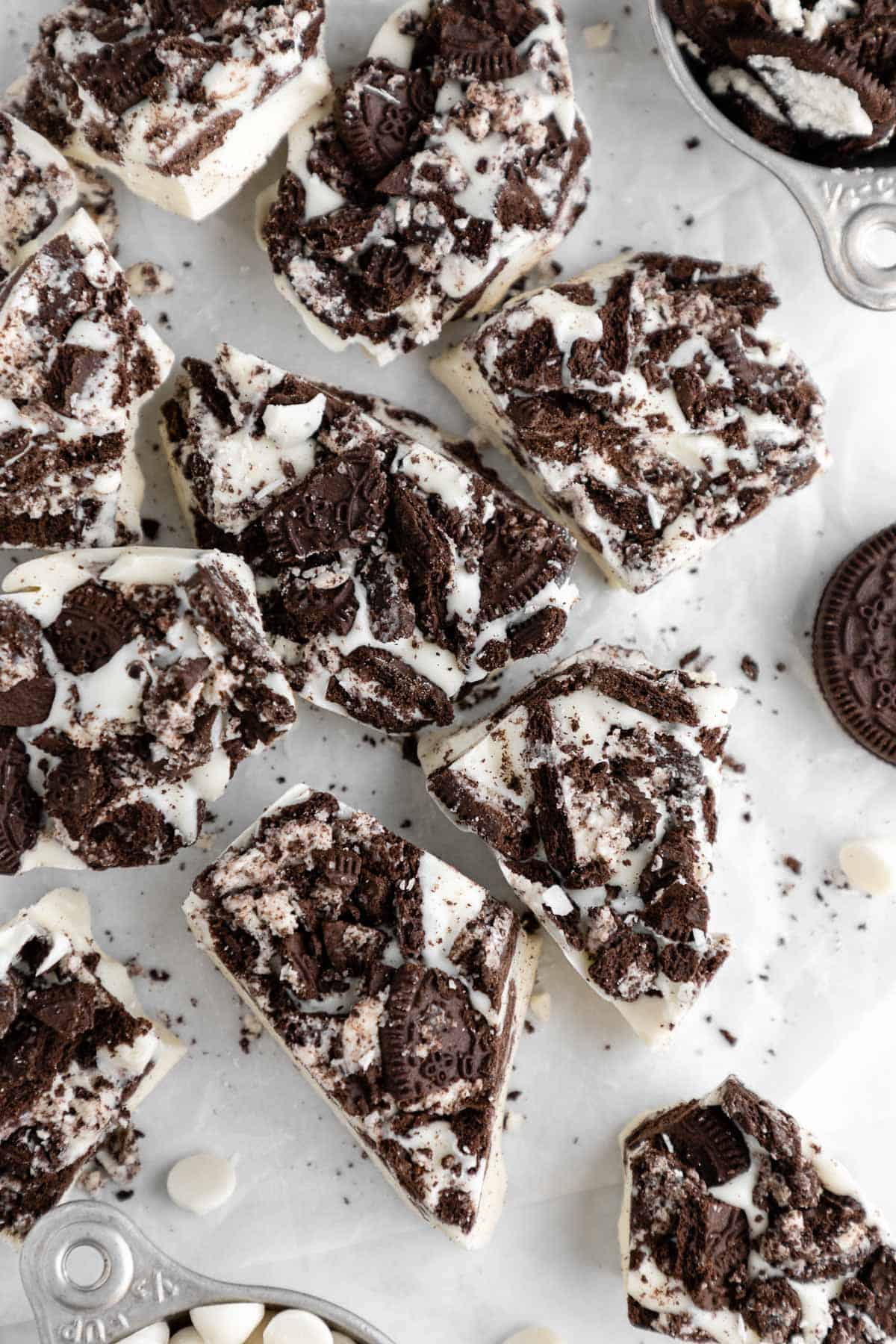 a pile of white chocolate cookies and cream bark with oreos