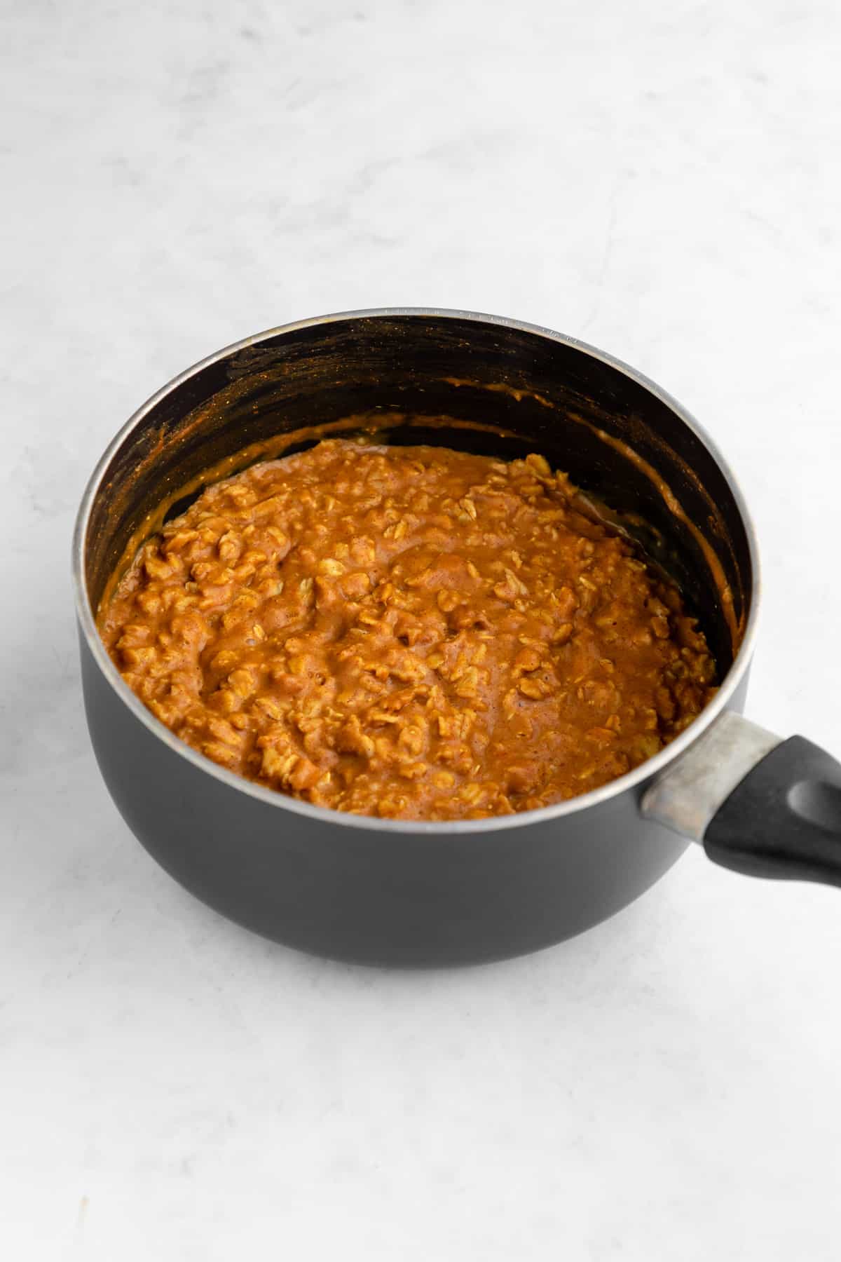 cooked stovetop pumpkin oatmeal in a small pot