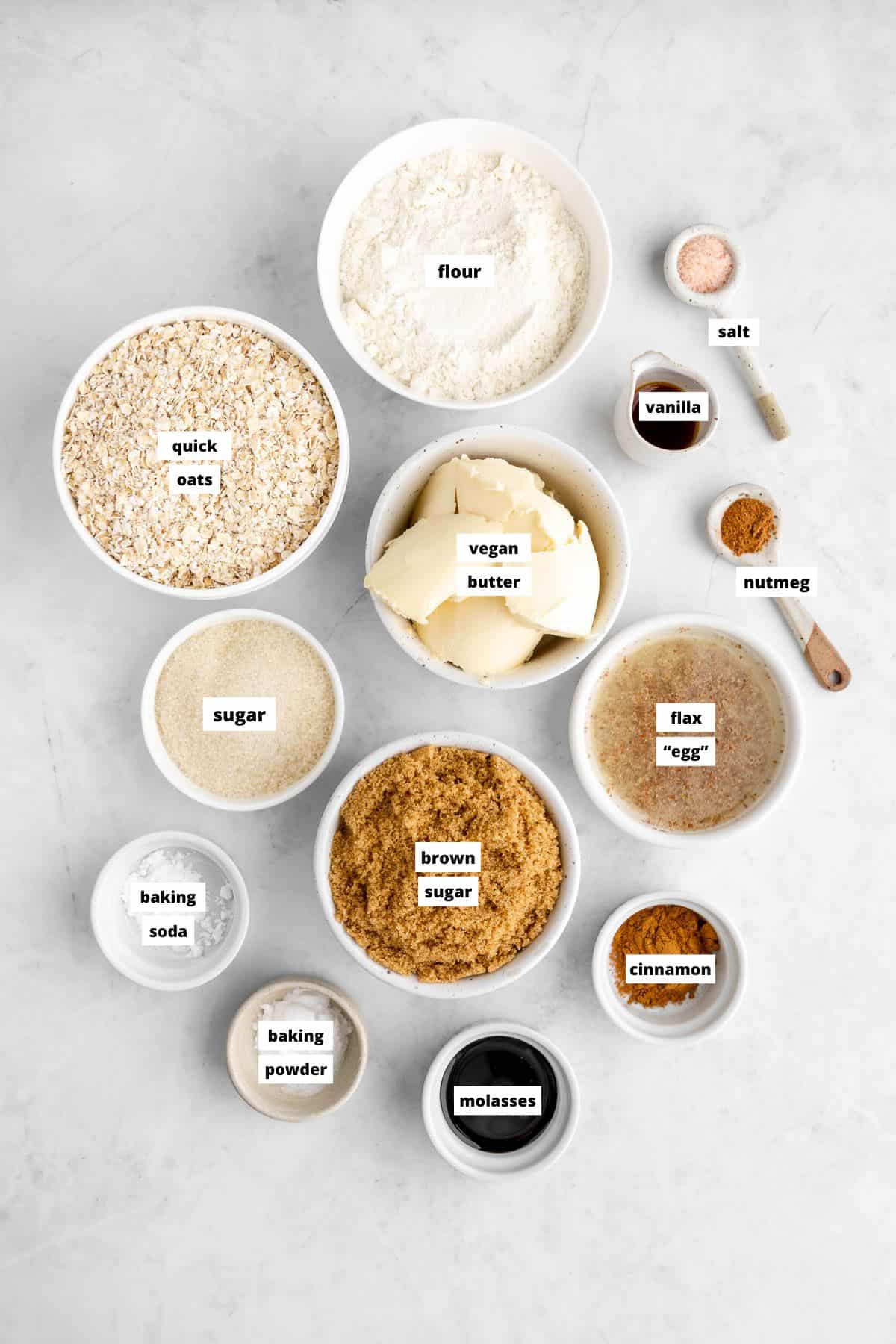 bowls of ingredients for vegan iced oatmeal cookies