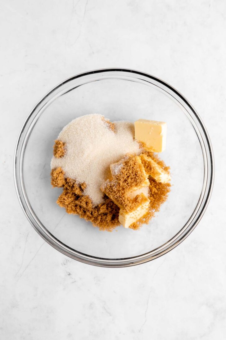 vegan butter, brown sugar, and sugar in a glass mixing bowl