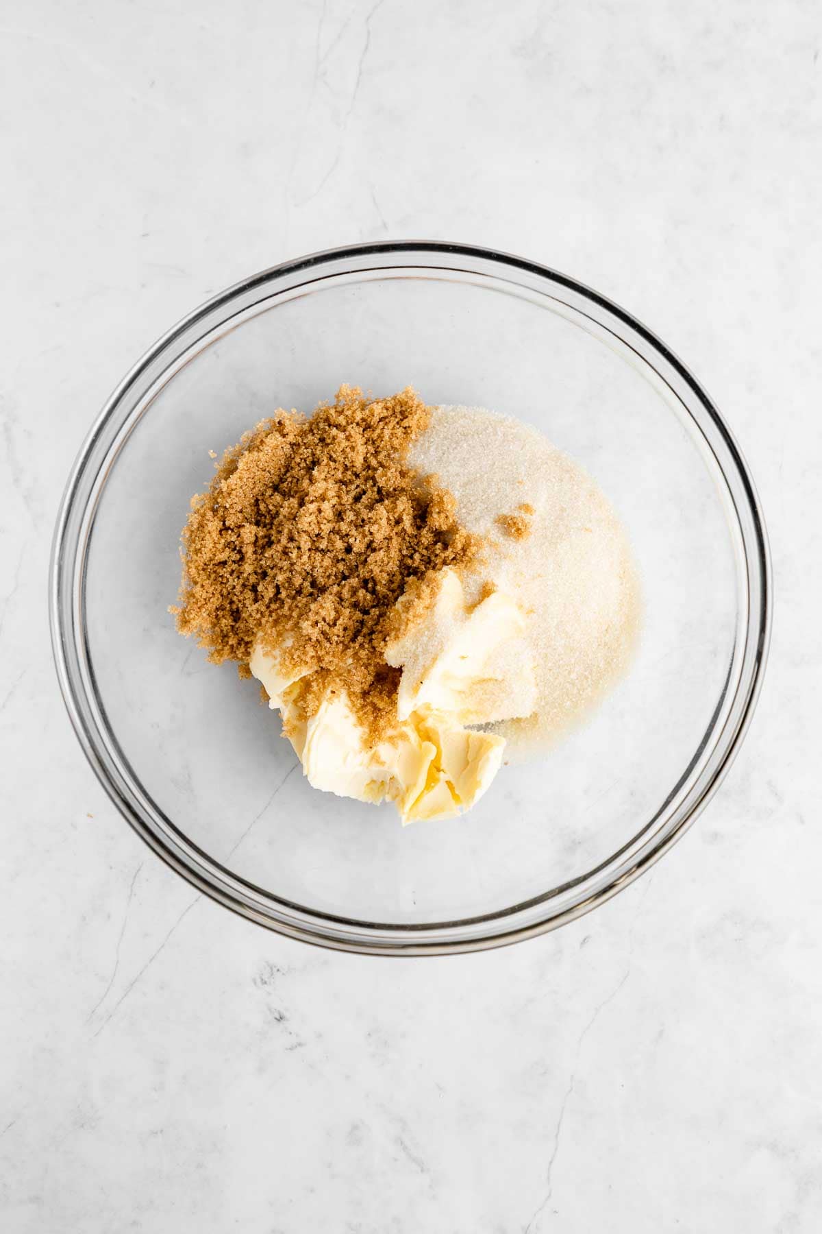 vegan butter, brown sugar, and sugar inside a glass bowl