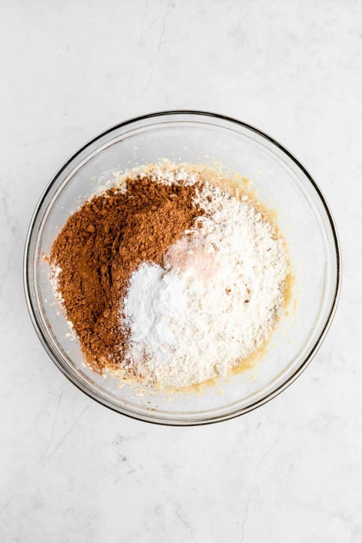vegan butter, sugar, flour, cocoa powder, and baking powder in a glass bowl