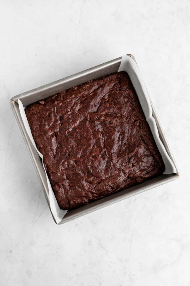 vegan peppermint brownies baked inside a square baking dish