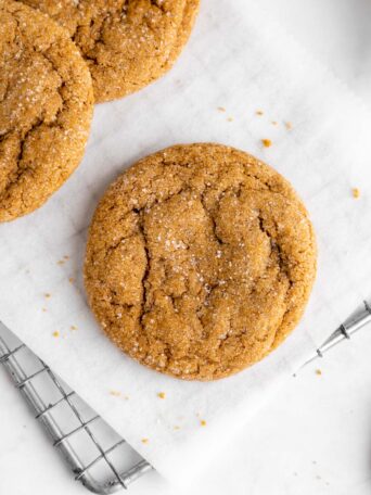 a close up of vegan brown sugar cookies on a wire cooling rack