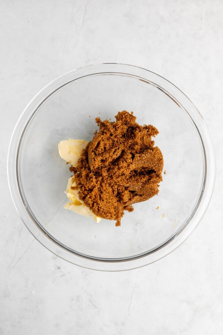 vegan butter and dark brown sugar in a glass mixing bowl