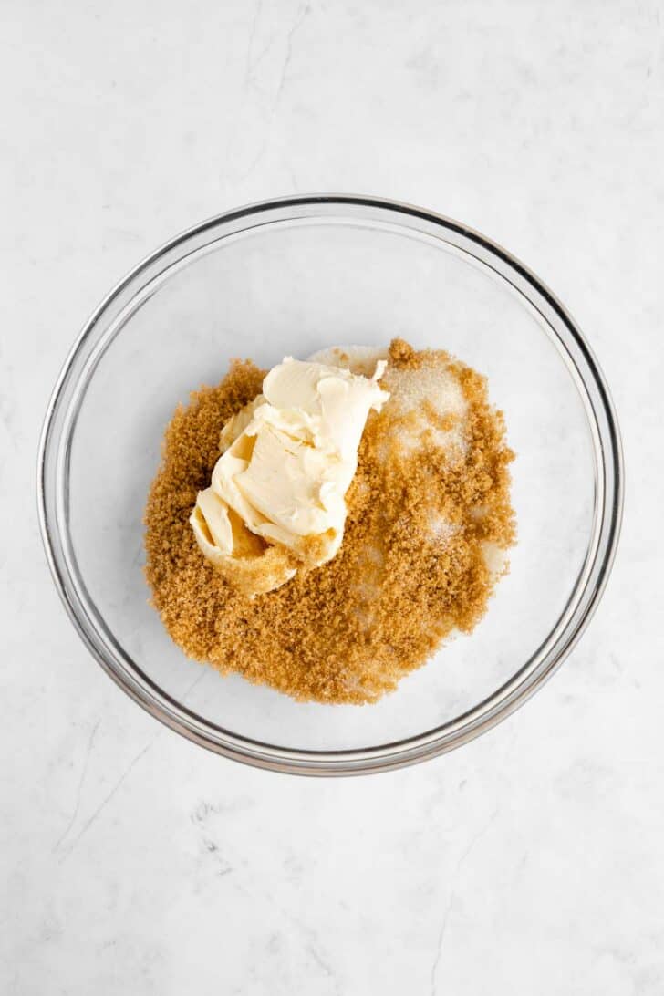 vegan butter, sugar, and brown sugar in a glass mixing bowl