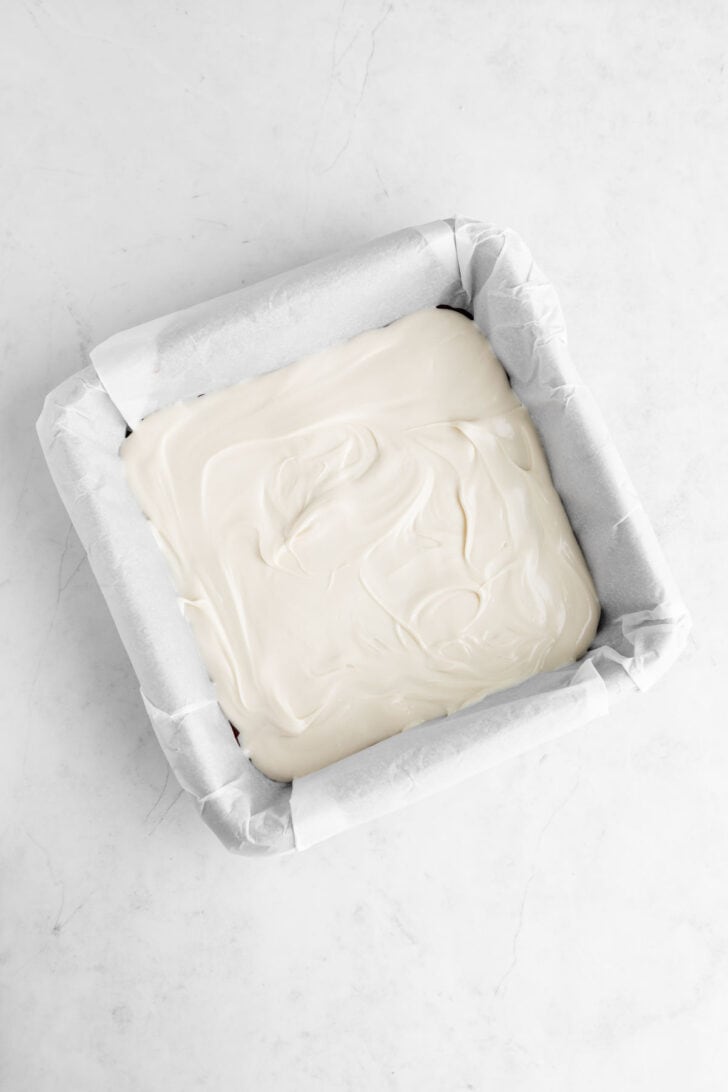 melted vegan white chocolate in a square baking dish