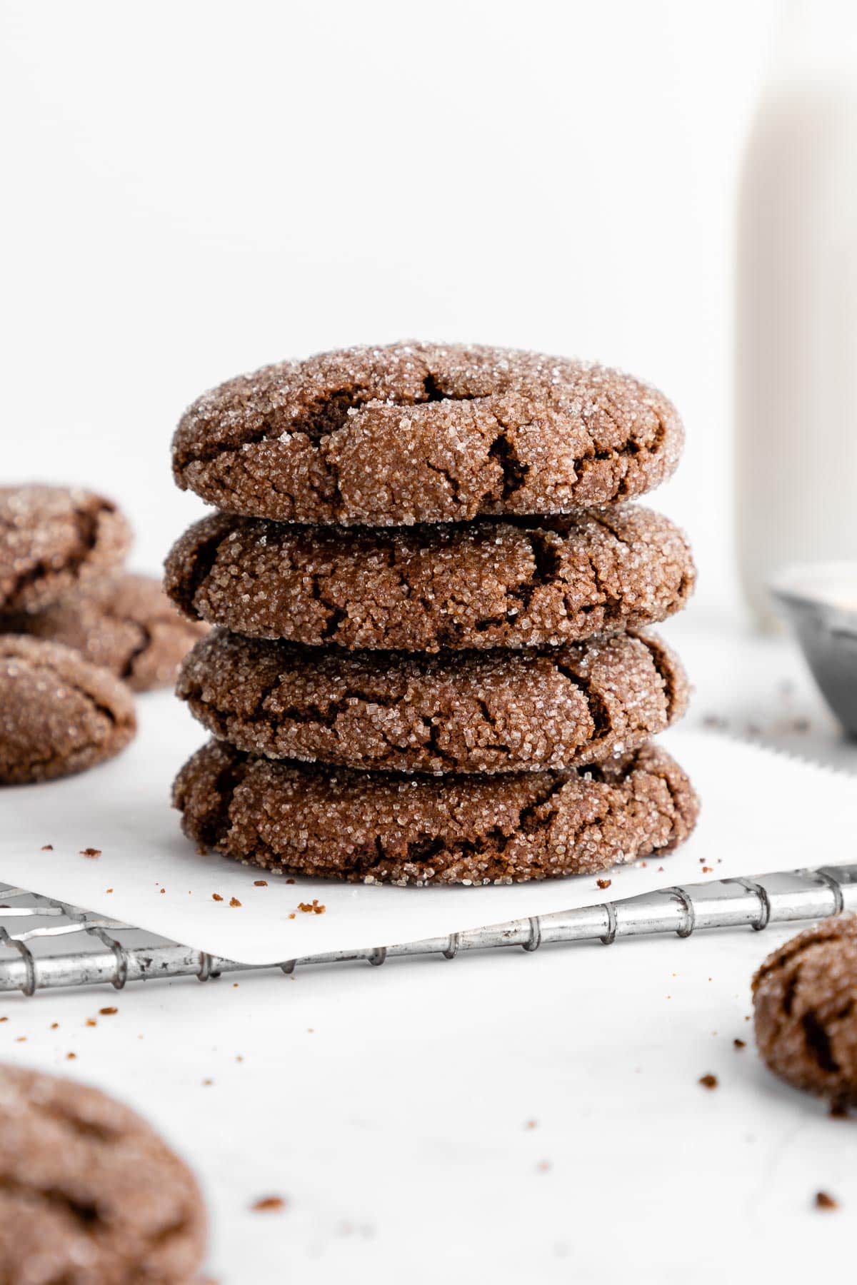 a stack of a vegan chocolate sugar cookies on a wire cooling rack