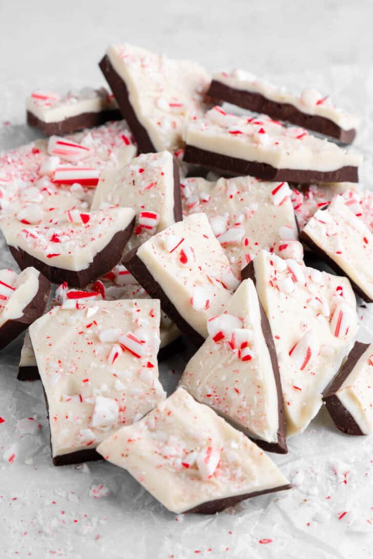 a pile of vegan peppermint bark with candy canes