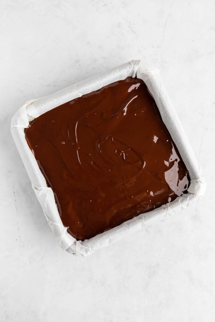 melted chocolate spread inside a square baking dish