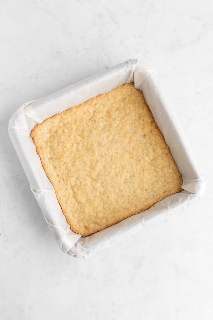baked vegan shortbread cookie dough in a square baking dish