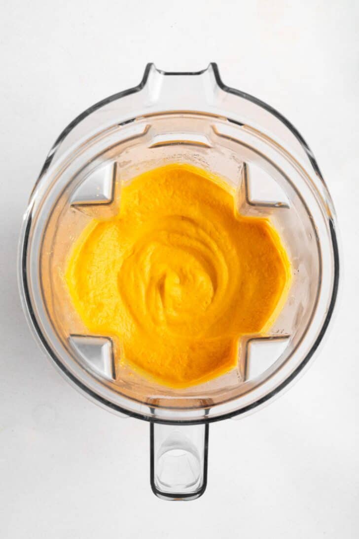 carrot and cashew vegan mac and cheese sauce inside a Vitamix blender