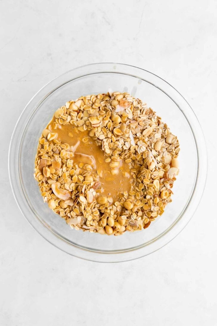 chunky monkey granola ingredients inside a glass bowl