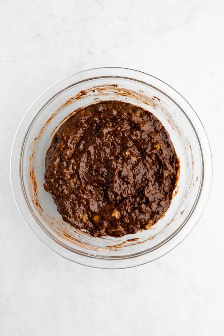 vegan banana brownies batter in a glass bowl