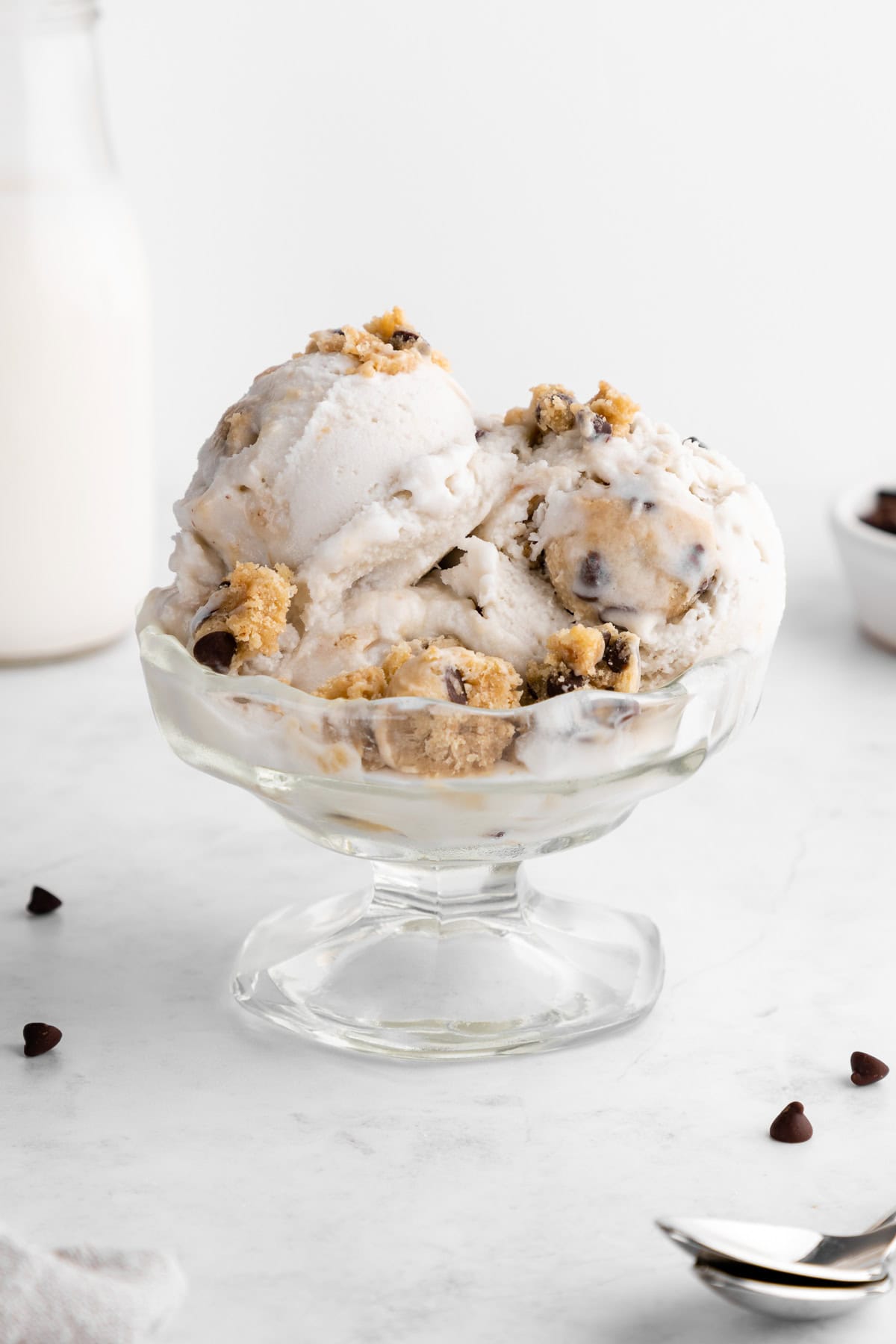 vegan cookie dough ice cream scoops inside a sundae glass