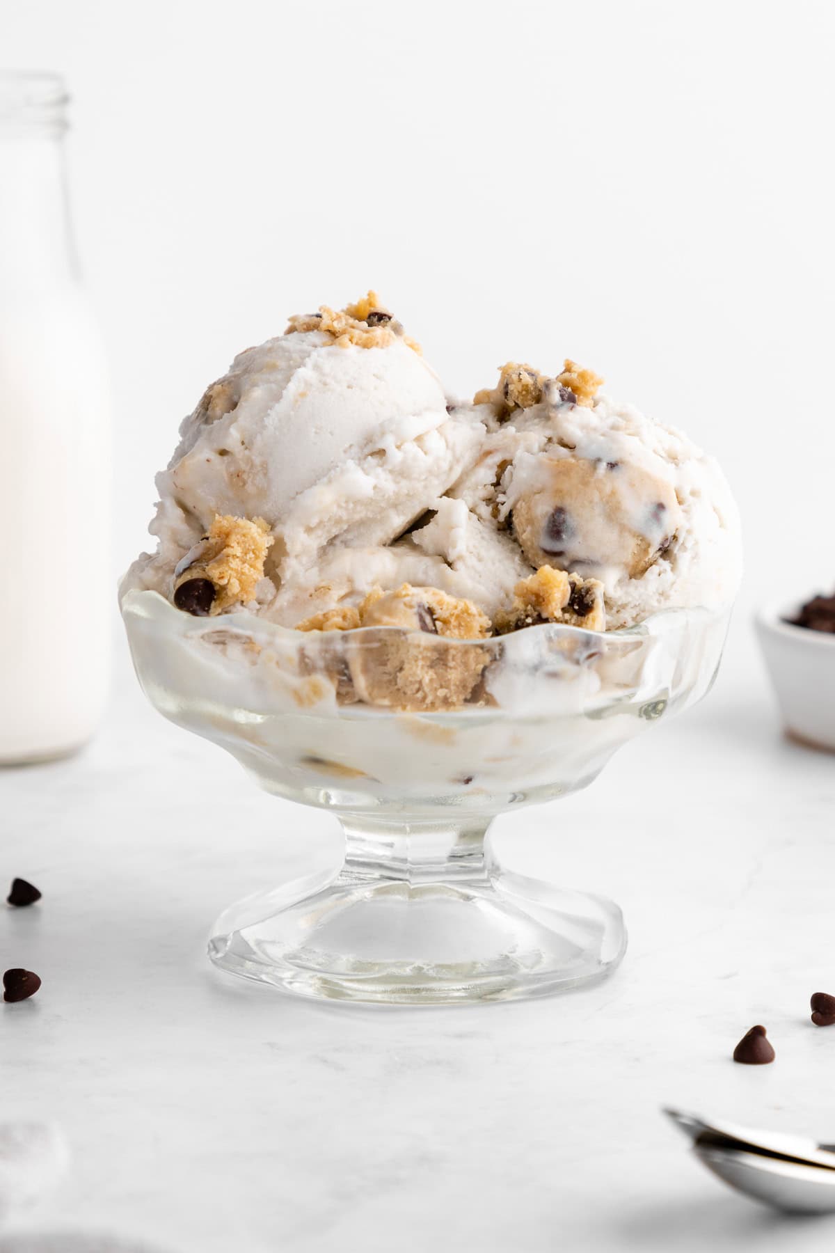 scoops of vegan cookie dough ice cream inside a sundae glass