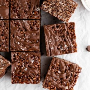 a pile of vegan chocolate rice krispie treats with chocolate chips