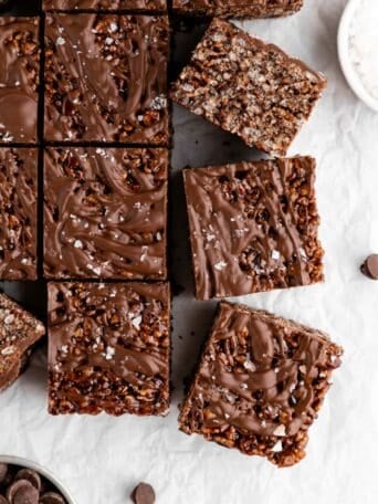 a pile of vegan chocolate rice krispie treats with chocolate chips