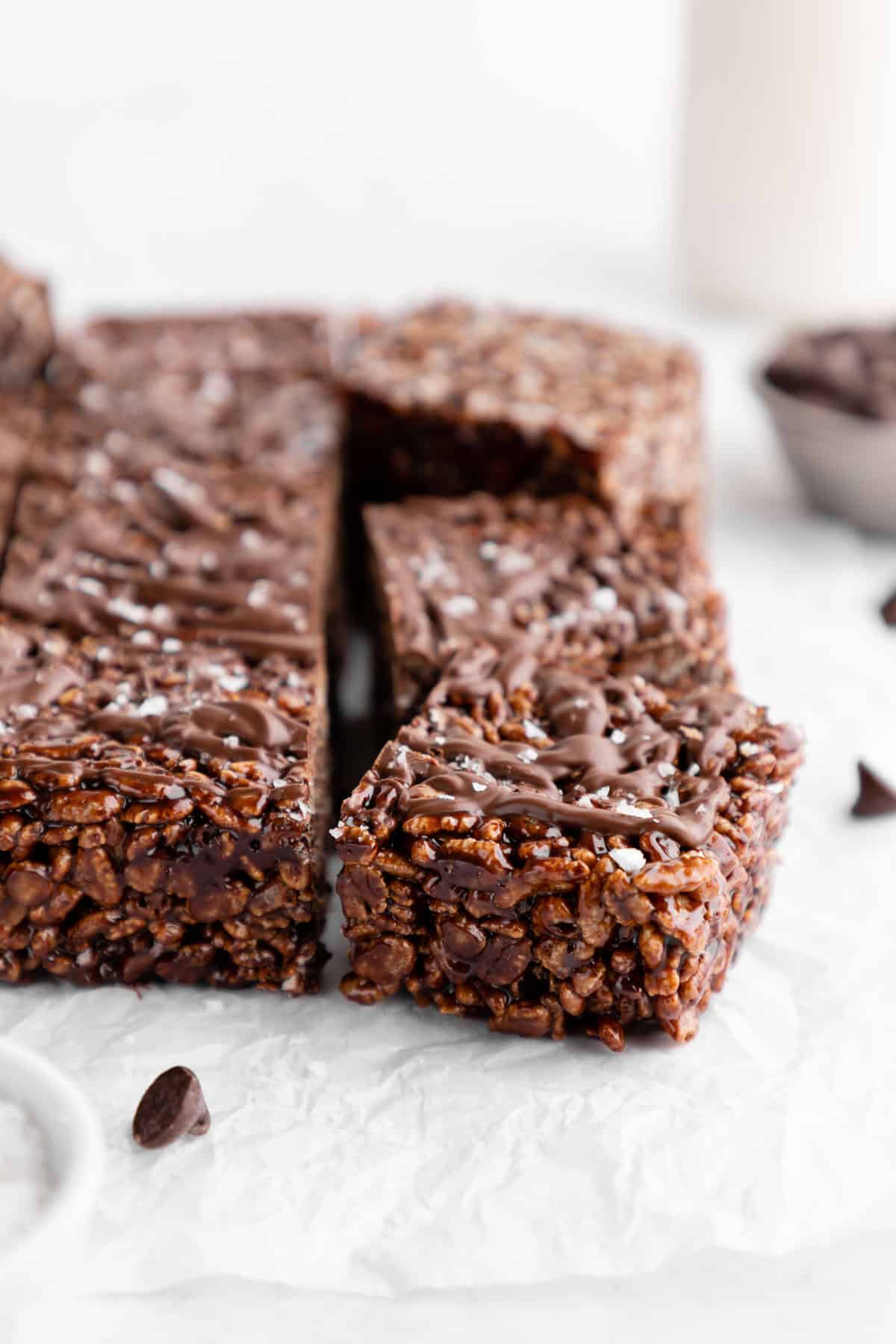a close up of vegan chocolate rice krispie treats with chocolate chips