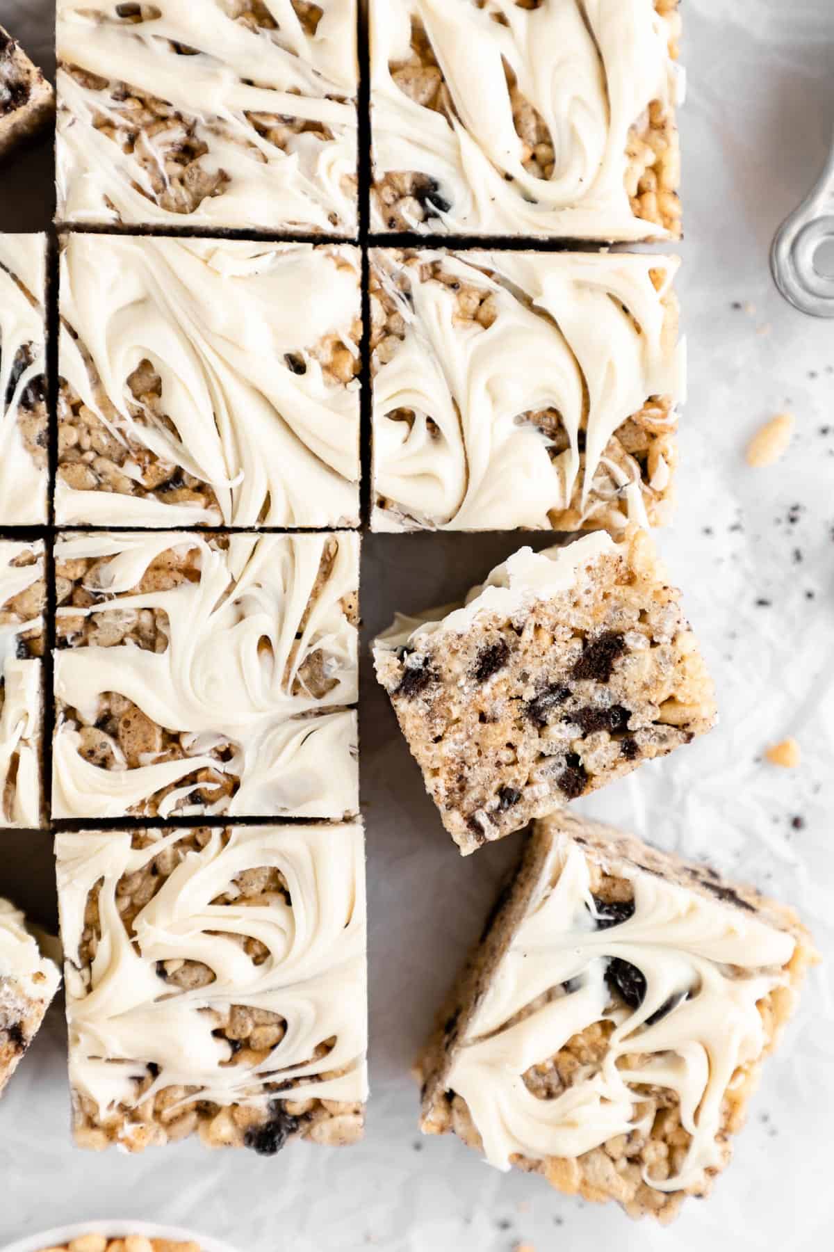 a pile of vegan cookies and cream rice krispie treats with oreos and white chocolate