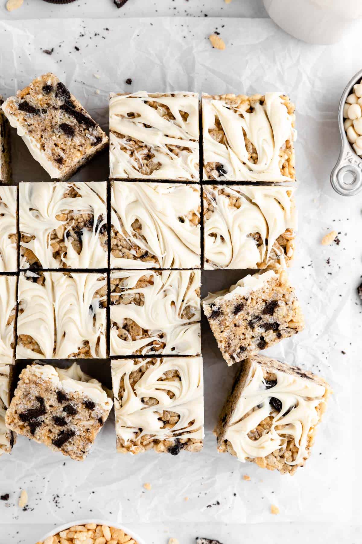 a pile of vegan cookies and cream rice krispie treats with white chocolate and oreos
