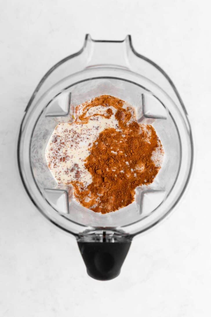 coconut milk, pumpkin puree, brown sugar, pumpkin pie spice, and cinnamon inside a Vitamix blender