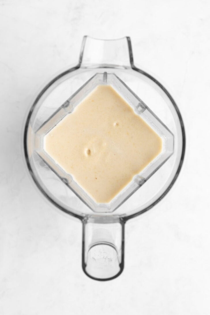 raw cashew cheesecake filling inside a vitamix blender