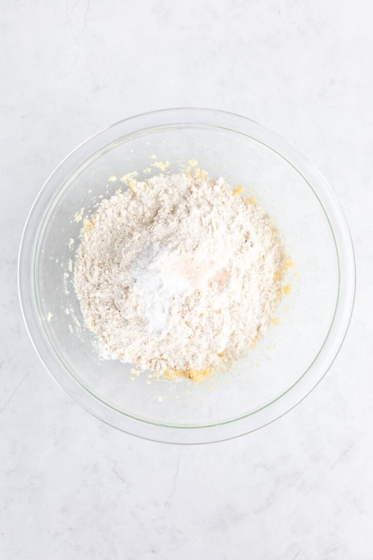 flour, sugar, and vegan butter inside a glass bowl
