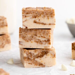 a stack of vegan white chocolate cinnamon roll fudge squares