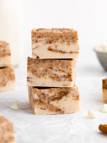 a stack of vegan white chocolate cinnamon roll fudge squares