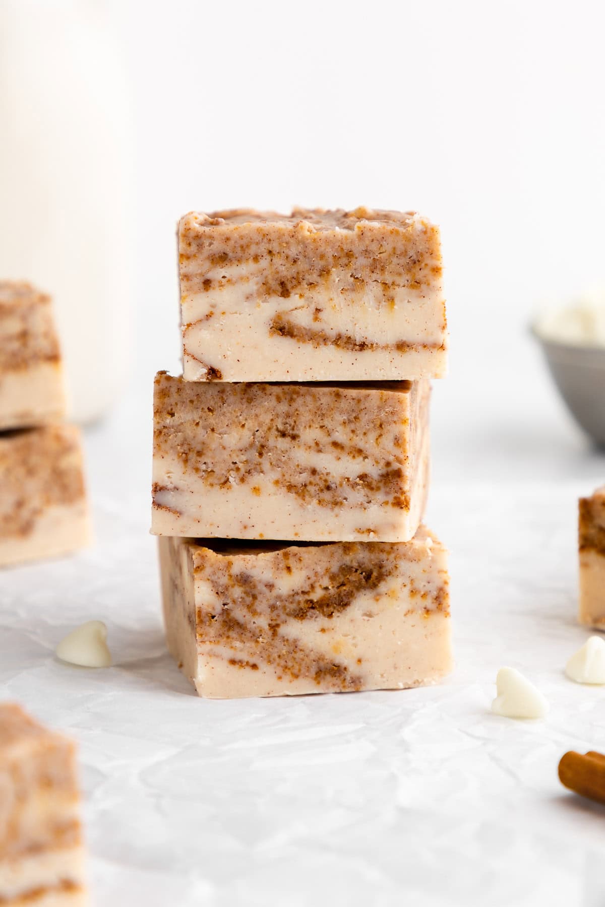 a stack of vegan white chocolate cinnamon roll fudge squares