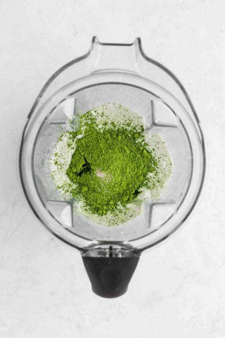 coconut milk, matcha powder, and sugar inside a vitamix blender
