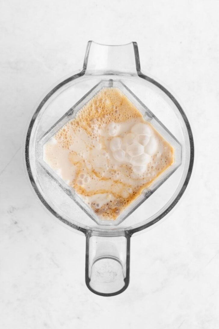 ingredients for oatmeal chocolate chip pancake batter inside a Vitamix blender