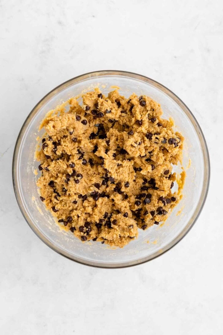 a bowl of healthy edible cookie dough for no-bake cookie dough cheesecake bars