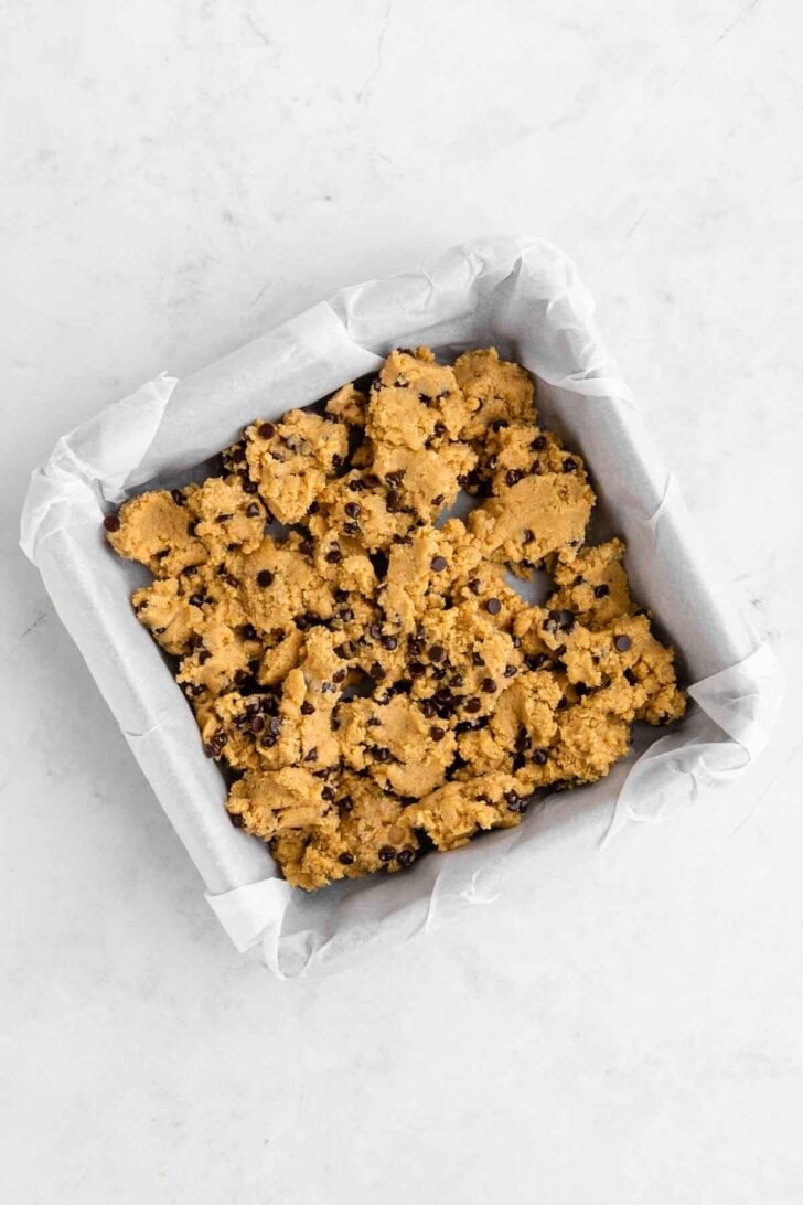 healthy edible cookie dough inside a square baking dish