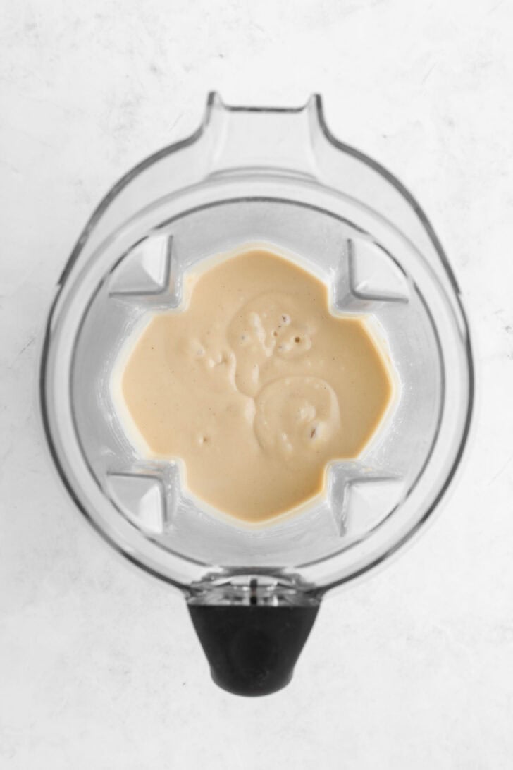 vegan no-bake cheesecake filling inside a vitamix blender