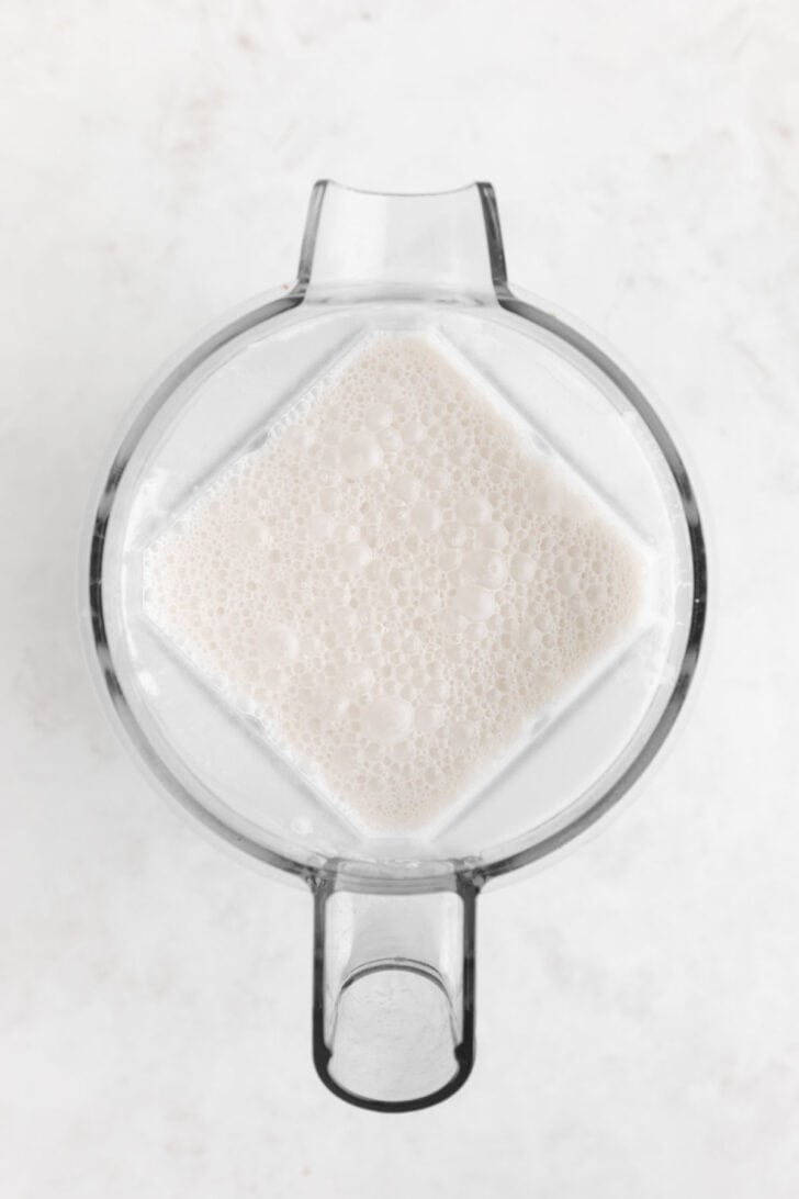 the liquid for vegan salted caramel ice cream inside a blender