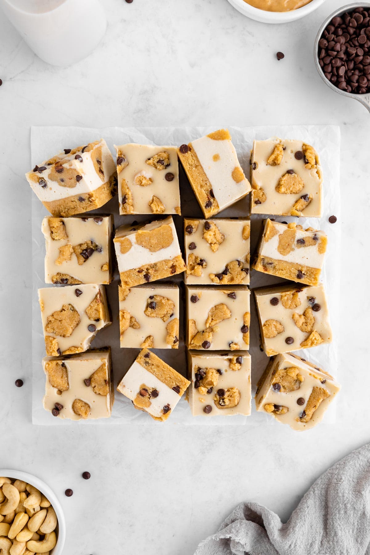 a pile of healthy vegan cookie dough cheesecake bars