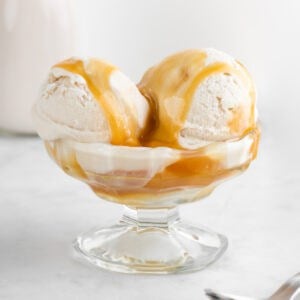 vegan salted caramel ice cream inside a glass sundae dish