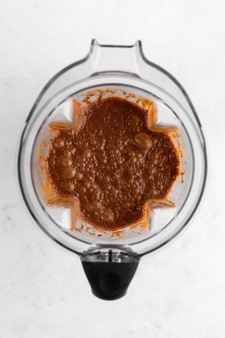 batter for vegan chocolate fudge brownie ice cream inside a blender