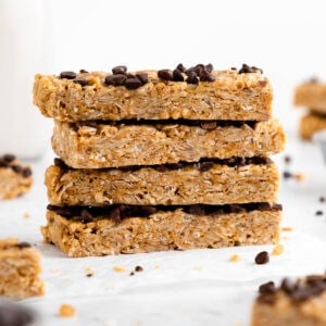 a stack of homemade coconut chocolate chip granola bars with peanut butter, oats, and honey