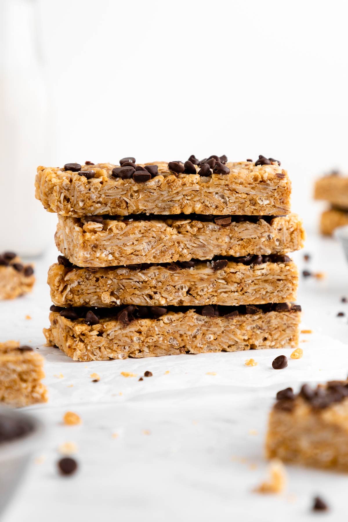 a stack of homemade coconut chocolate chip granola bars with peanut butter, oats, and honey