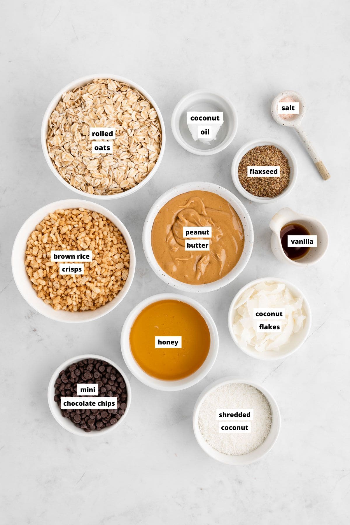 bowls of ingredients for homemade coconut chocolate chip granola bars