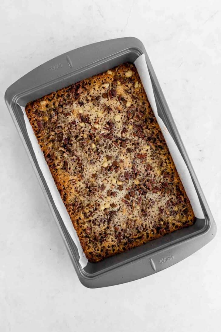 baked seven layer magic cookie bars inside a 9x13 baking pan